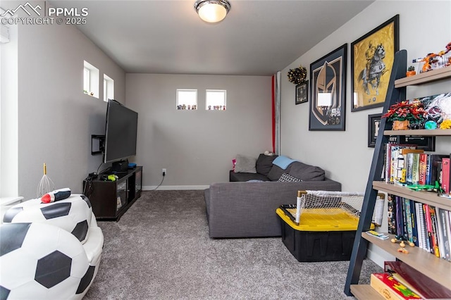 living room featuring carpet and baseboards