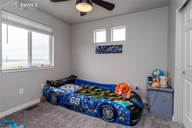 bedroom with baseboards, ceiling fan, visible vents, and carpet floors