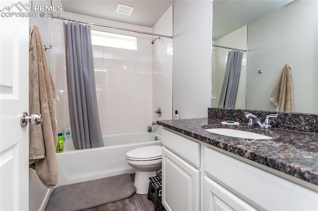 full bathroom with toilet, shower / bathtub combination with curtain, visible vents, vanity, and wood finished floors