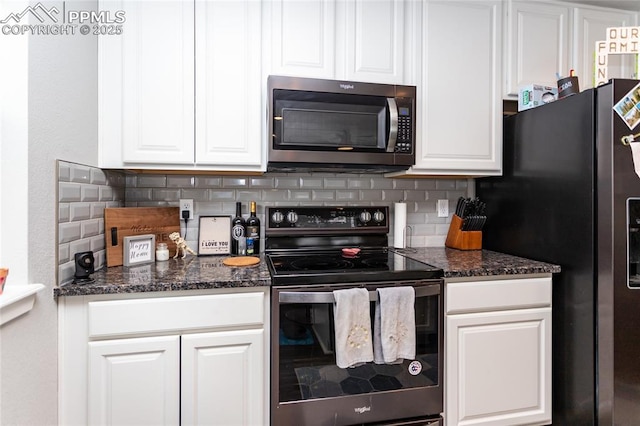 kitchen with stainless steel appliances, tasteful backsplash, dark stone countertops, and white cabinets