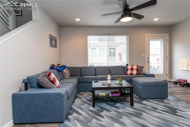 living room with a ceiling fan, baseboards, recessed lighting, and wood finished floors