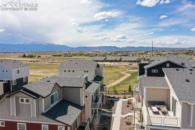 drone / aerial view with a residential view and a mountain view
