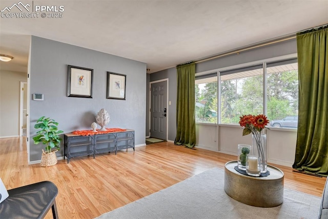 living room featuring baseboards and wood finished floors