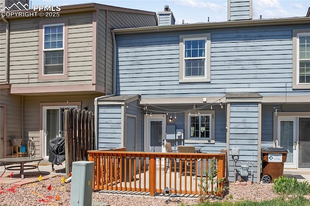 3319 Queen Anne Way, Colorado Springs, CO 80917 - rear view of house featuring a chimney