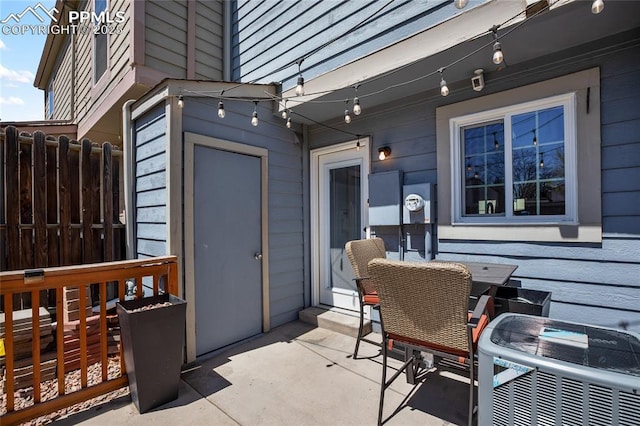 3319 Queen Anne Way, Colorado Springs, CO 80917 - view of patio / terrace with fence, outdoor dining area, and cooling unit