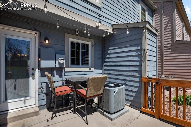 3319 Queen Anne Way, Colorado Springs, CO 80917 - view of patio / terrace with outdoor dining area and central AC