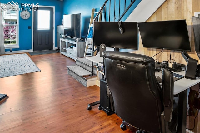 3319 Queen Anne Way, Colorado Springs, CO 80917 - living area featuring baseboards, wood finished floors, and stairway