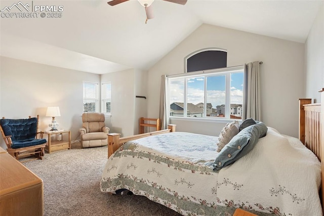 carpeted bedroom with ceiling fan and vaulted ceiling