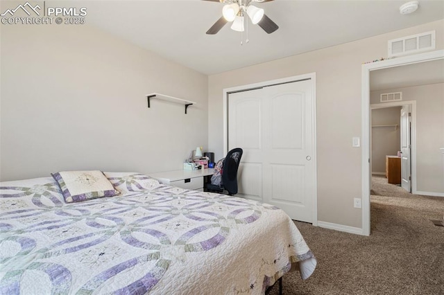 bedroom featuring baseboards, visible vents, carpet, and a closet