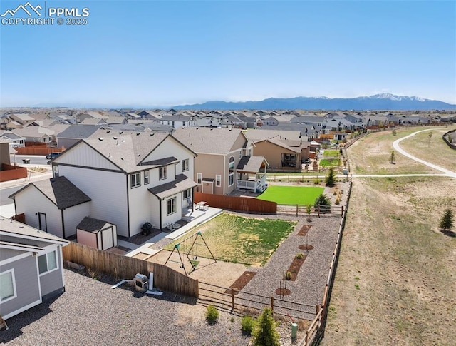 drone / aerial view with a mountain view and a residential view