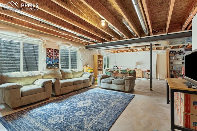 living area with concrete flooring and plenty of natural light