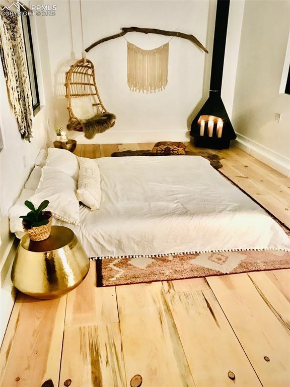interior details featuring baseboards and wood finished floors
