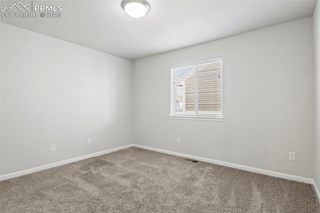 carpeted empty room with baseboards and visible vents