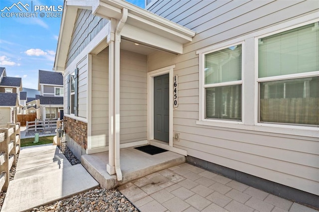 property entrance featuring fence