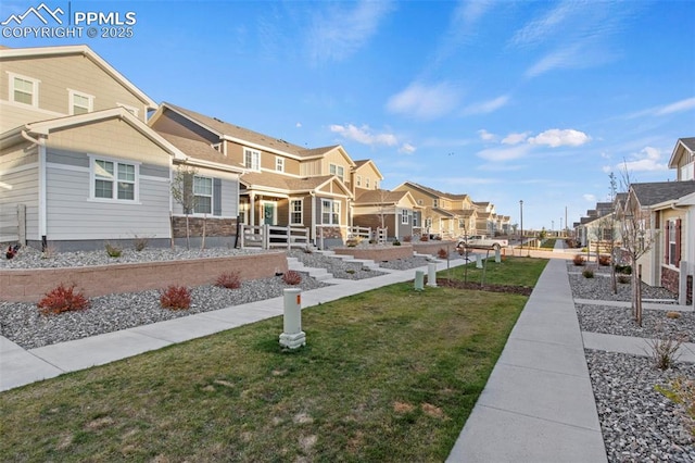 exterior space featuring a residential view and a front yard