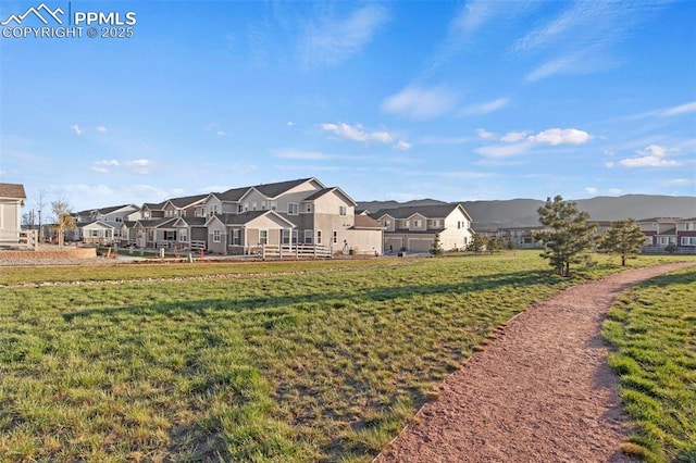 surrounding community featuring a lawn and a residential view