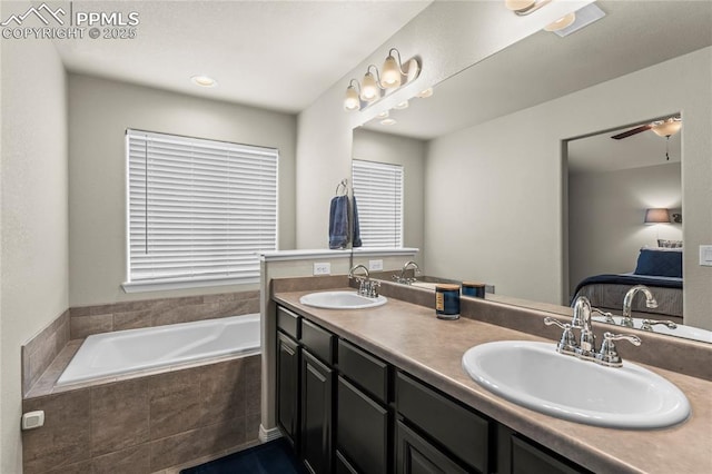 6647 Weiser Dr, Colorado Springs, CO 80925 - ensuite bathroom with a bath, double vanity, a sink, and ensuite bathroom