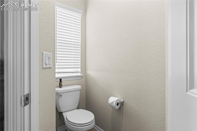 6647 Weiser Dr, Colorado Springs, CO 80925 - bathroom with a textured wall and toilet