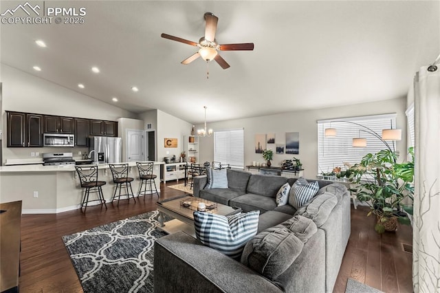 6647 Weiser Dr, Colorado Springs, CO 80925 - living room with recessed lighting, vaulted ceiling, ceiling fan with notable chandelier, and dark wood-type flooring
