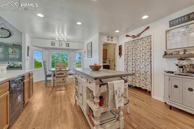 16440 Eastonville Rd, Elbert, CO 80106 - kitchen featuring black dishwasher, light wood-style flooring, a chandelier, light countertops, and recessed lighting