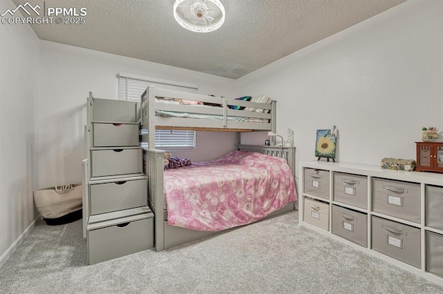 16440 Eastonville Rd, Elbert, CO 80106 - carpeted bedroom featuring a textured ceiling and baseboards