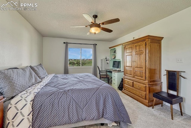 16440 Eastonville Rd, Elbert, CO 80106 - bedroom featuring light carpet, a textured ceiling, and a ceiling fan