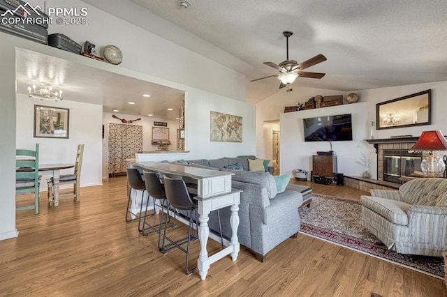 16440 Eastonville Rd, Elbert, CO 80106 - living area featuring vaulted ceiling, wood finished floors, and ceiling fan