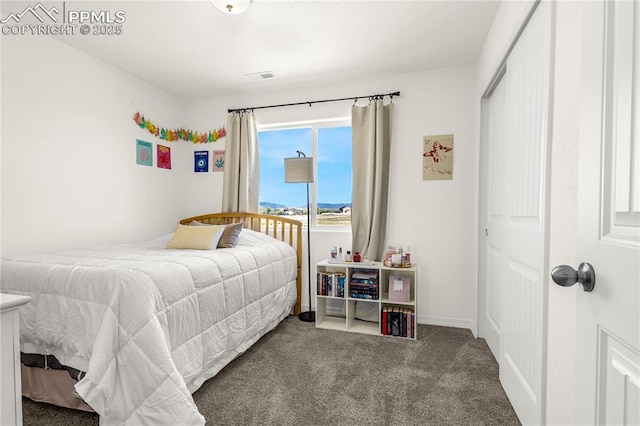 bedroom with carpet, a closet, and visible vents