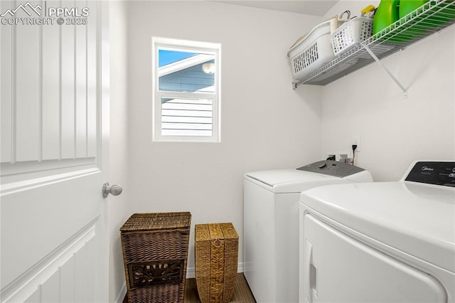 laundry area with laundry area and separate washer and dryer