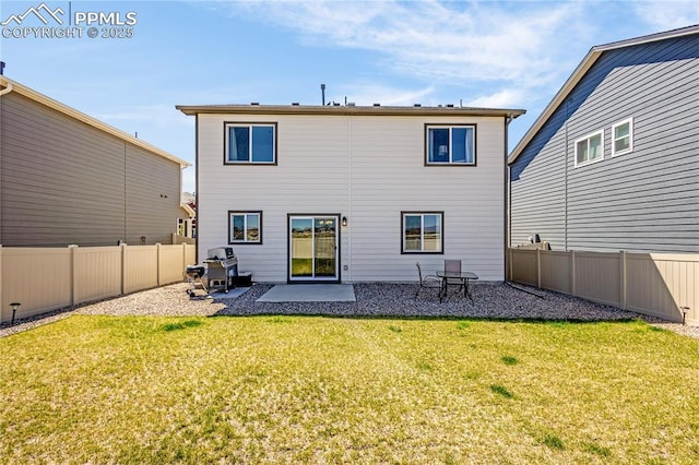 back of house featuring a patio area, a lawn, and a fenced backyard
