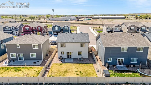 birds eye view of property with a residential view