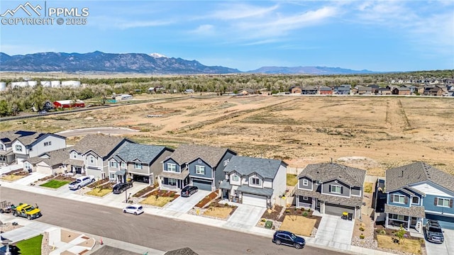 birds eye view of property featuring a mountain view and a residential view