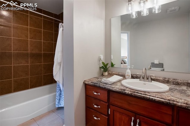 bathroom with tile patterned flooring, shower / bath combo, and vanity