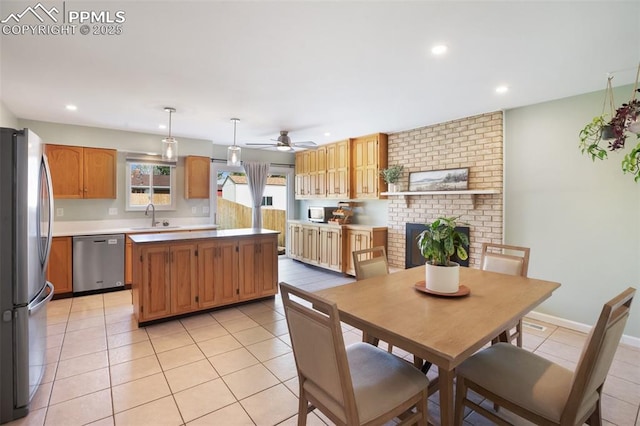 dining room with a brick fireplace, baseboards, ceiling fan, light tile patterned flooring, and recessed lighting