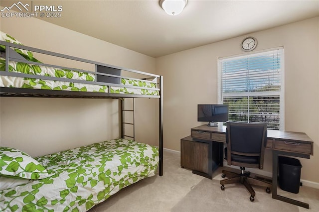 carpeted bedroom with baseboards