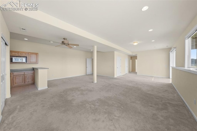 unfurnished living room featuring visible vents, recessed lighting, ceiling fan, and light carpet