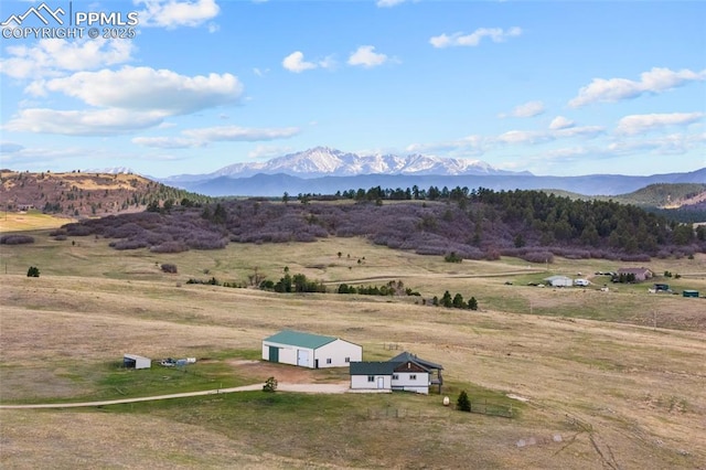 view of mountain feature with a rural view