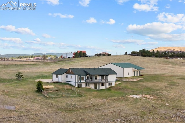 birds eye view of property featuring a rural view