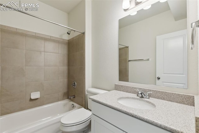bathroom with toilet, bathing tub / shower combination, and vanity