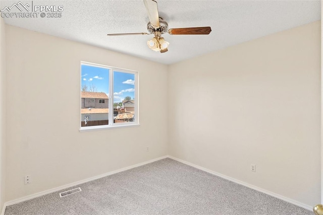 unfurnished room with visible vents, baseboards, carpet floors, and ceiling fan