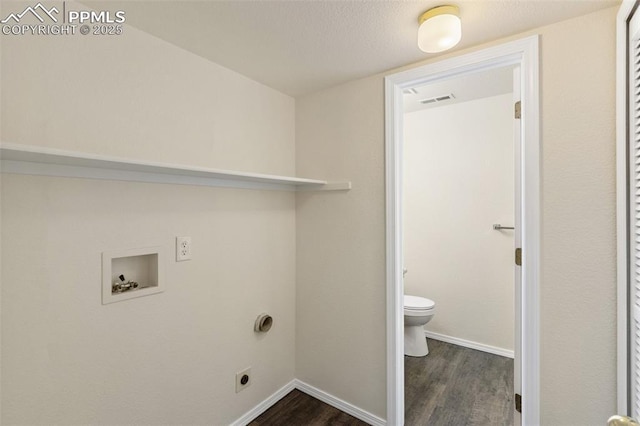 laundry area with laundry area, electric dryer hookup, baseboards, hookup for a washing machine, and dark wood-type flooring