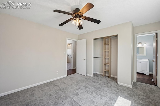 unfurnished bedroom with carpet floors, baseboards, ceiling fan, and a closet