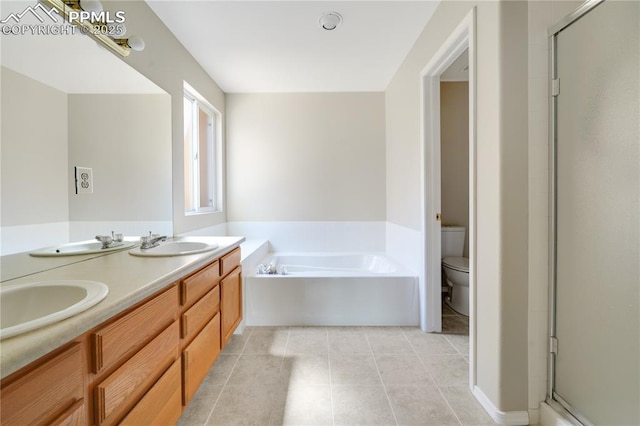 4282 Thornbury Way, Colorado Springs, CO 80922 - full bath with toilet, a stall shower, a garden tub, and tile patterned floors