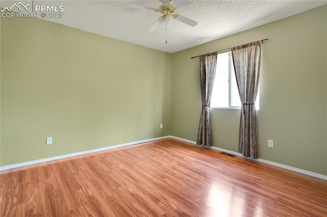 4282 Thornbury Way, Colorado Springs, CO 80922 - spare room featuring a ceiling fan, wood finished floors, baseboards, and a textured ceiling