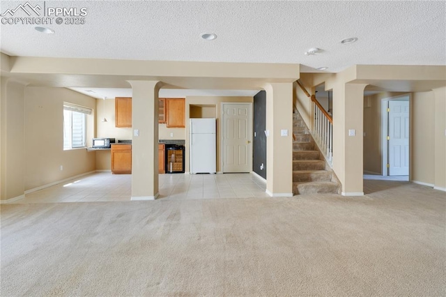 4282 Thornbury Way, Colorado Springs, CO 80922 - unfurnished living room with light carpet, a textured ceiling, light tile patterned floors, stairway, and baseboards