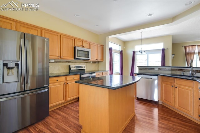 4282 Thornbury Way, Colorado Springs, CO 80922 - kitchen with stainless steel appliances, a sink, healthy amount of natural light, dark wood-style flooring, and recessed lighting