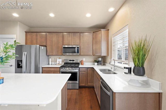 2972 Namib Dr, Colorado Springs, CO 80939 - kitchen with light countertops, dark wood-style flooring, appliances with stainless steel finishes, and a sink