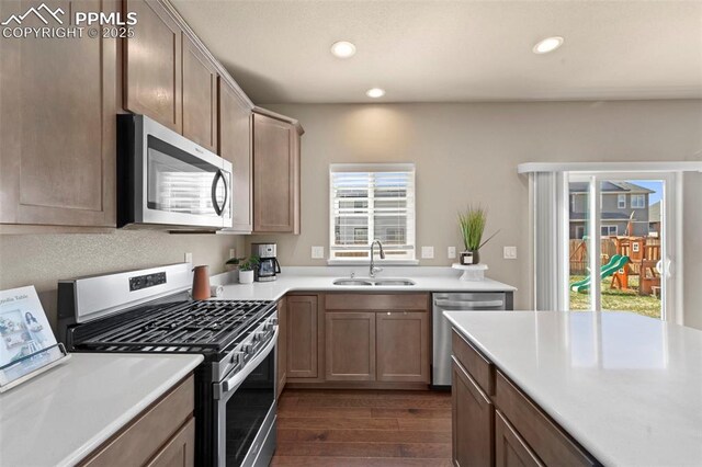 2972 Namib Dr, Colorado Springs, CO 80939 - kitchen featuring a sink, light countertops, stainless steel appliances, recessed lighting, and dark wood-type flooring