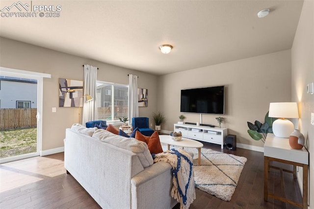 2972 Namib Dr, Colorado Springs, CO 80939 - living room featuring baseboards and wood-type flooring
