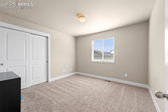 2972 Namib Dr, Colorado Springs, CO 80939 - unfurnished bedroom with carpet flooring, baseboards, visible vents, and a closet